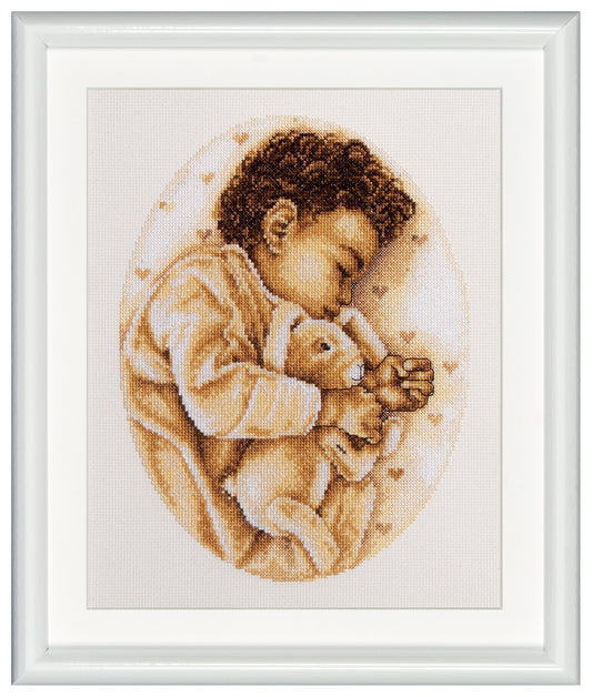 Design of a toddler taking a nap with his stuffed soft toy rabbit. You can notice fine detailing through the oval-shaped design outline. Capturing the pure essence of innocent childhood. a Beautiful design perfect for your little one's room. DSB cross stitch kits have easy to follow design charts and contain all items needed to facilitate embroidery without hassle. To cater to both beginners as well as advanced stitching artists.